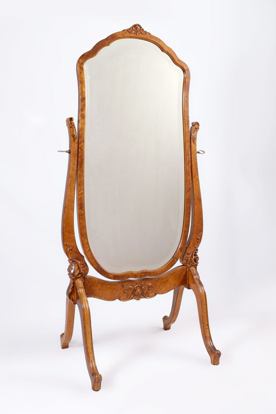 CARVED BIRDS EYE MAPLE CHEVAL MIRROR: CARVED BIRDS EYE MAPLE CHEVAL MIRROR: Birds eye maple shaped frame with beveled glass mirror, carved harp and base with splayed legs, 65 3/4" h. x 30 1/4" x 24".