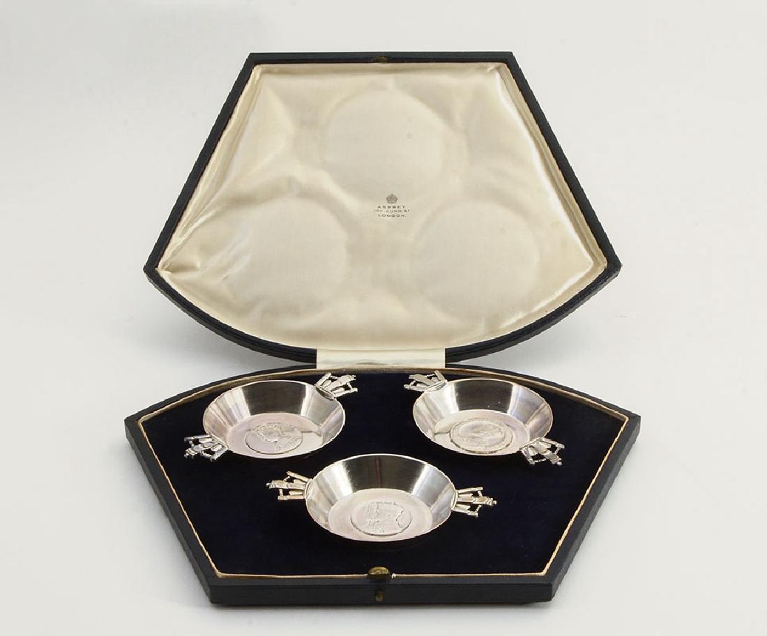 ASPREY ENGLISH STERLING 1937 CORONATION CUPS: ASPREY ENGLISH STERLING 1937 CORONATION CUPS IN PRESENTATION BOX: Commemoration the coronation of King George VI and Queen Elizabeth, each small double handled silver cup with a different center medal