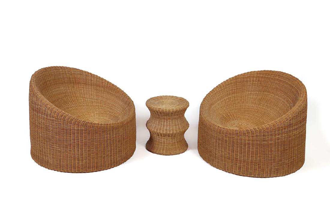 PAIR EERO AARNIO ELEPHANT BOOT RATTAN CHAIRS: PAIR EERO AARNIO ELEPHANT BOOT RATTAN CHAIRS: Comprising of 2 chairs and a side table, designed by Eero Aarnio, woven rattan bodies, marked on internal stretchers of chairs. Each chair measures 26 1/2
