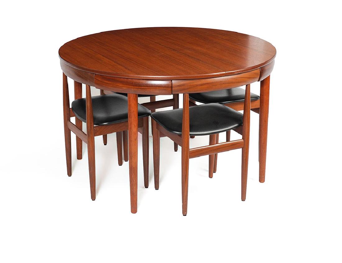 HANS OLSEN FOR FREM ROJLE TABLE & 4 CHAIRS: HANS OLSEN FOR FREM ROJLE TABLE & 4 CHAIRS: Teak round table designed by Hans Olsen for Frem Rojle with four 4 legged chairs that tuck neatly inside with contours of the skirt. Table with tapered roun