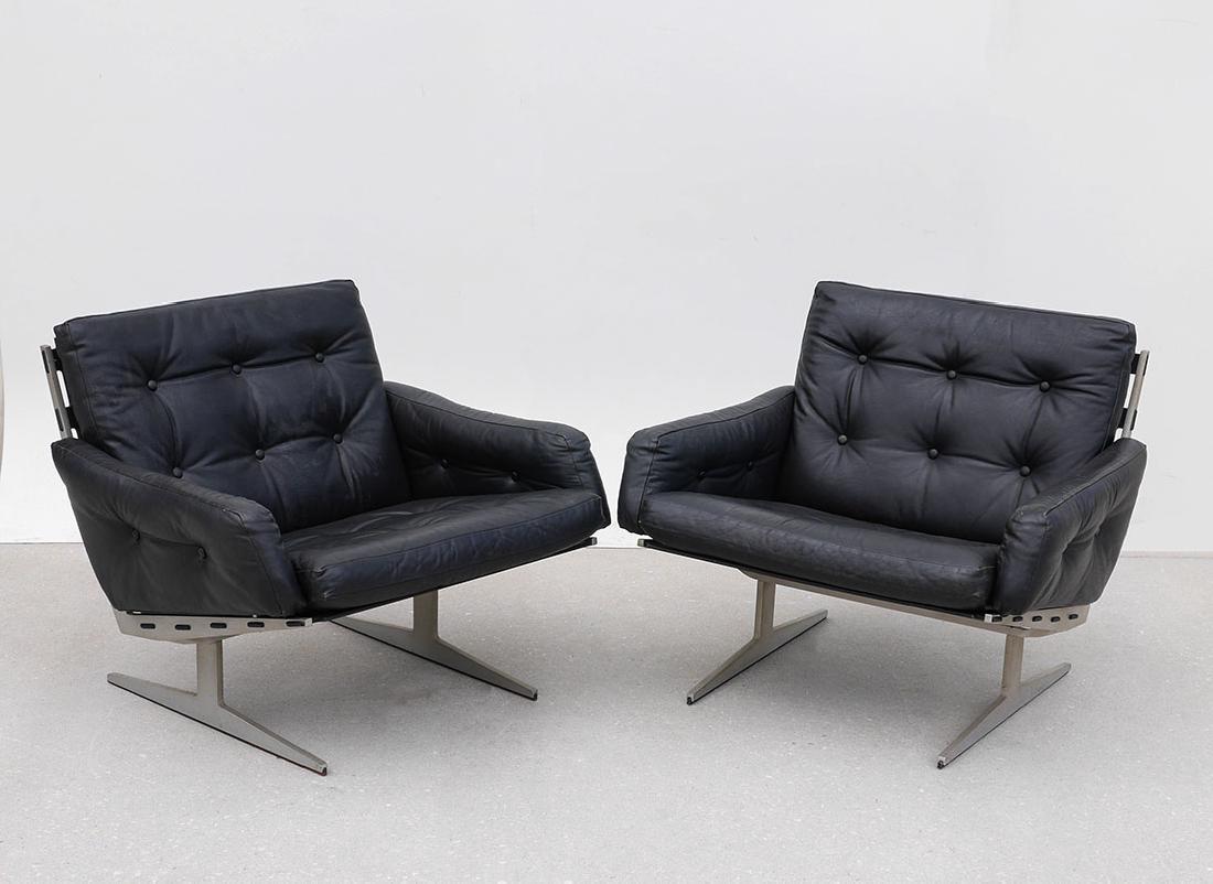 PAIR PAUL LEIDERSDORFF CARAVELLE LOUNGE CHAIRS: PAIR PAUL LEIDERSDORFF CARAVELLE LOUNGE CHAIRS: Chrome metal supports, painted black wood back and seats, tufted leather cushions. Unusual to find these popular lounge chairs designed for Cado with ar