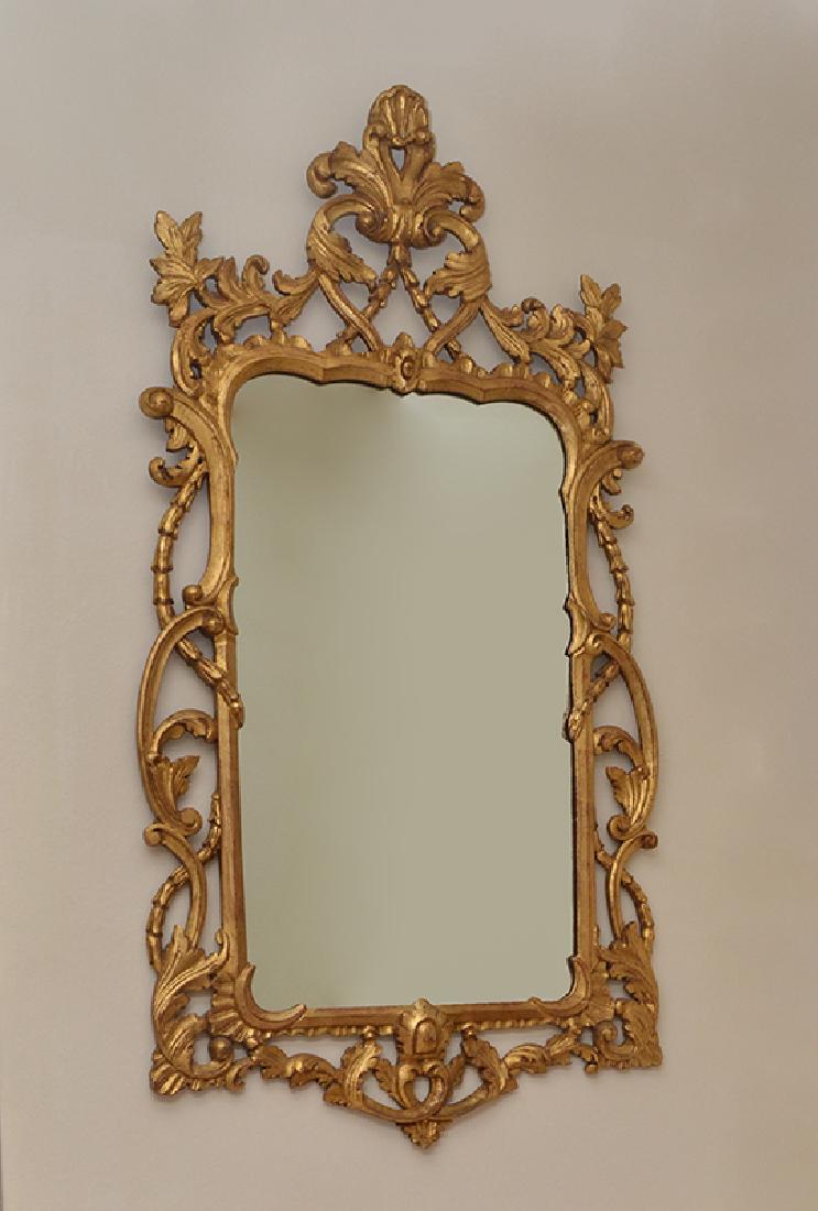 LABARGE CARVED GILT WOOD ROCOCO STYLE MIRROR: LABARGE CARVED GILT WOOD ROCOCO STYLE MIRROR: 20th century production, carved gilt wood frame with foliate scroll motif, original LaBarge label on back with hanging instructions. Overall 52 1/2'' h. x