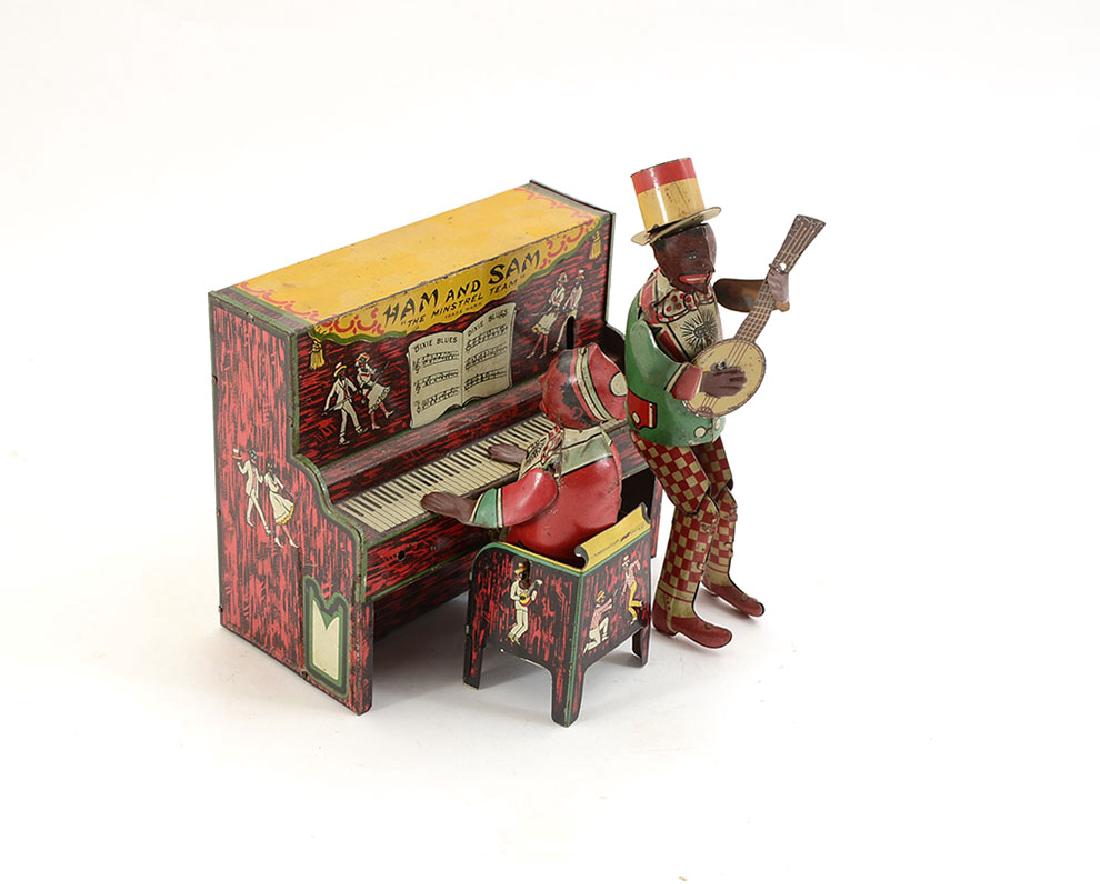 STRAUSS HAM AND SAM TIN LITHO WIND UP TOY: STRAUSS HAM AND SAM TIN LITHO WIND UP TOY: Hamm and Samm "The Minstrel Team", key wind, tin lithography, by The Ferdinand Strauss Corporation, New York, Patented 1921. Overall measures 8 1/4" h. x 6 1