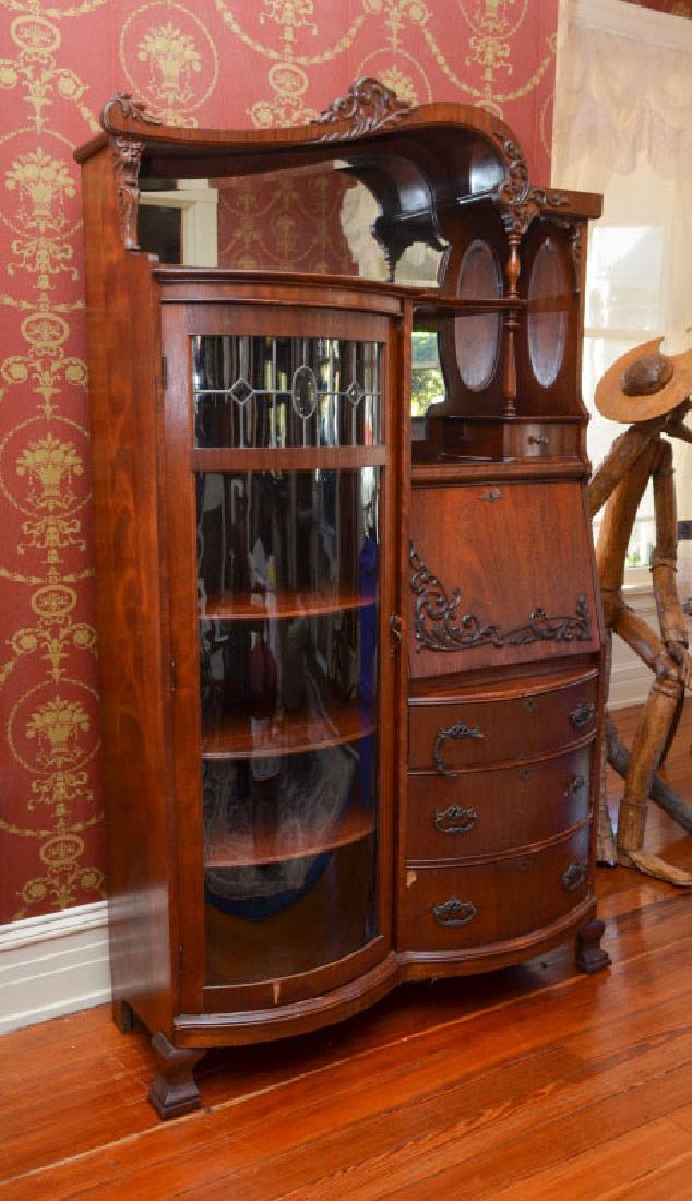 DOUBLE BOWED SIDE BY SIDE SECRETARY BOOKCASE CURIO: A SUPERB VICTORIAN DOUBLE BOWED SIDE BY SIDE SECRETARY BOOKCASE CURIO: From the Historic Bailey House in Fernandina Beach, FL. A slanted fall front desk ''side by side'' to a bowed glass front bookcas