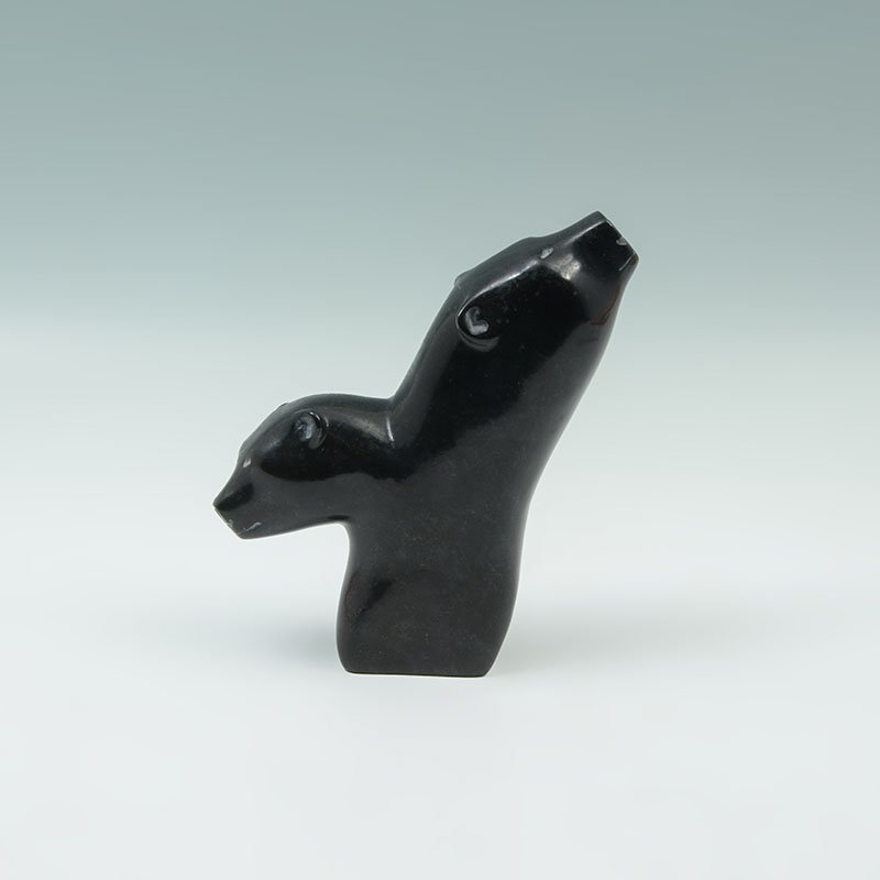 CANADIAN ESKIMO ART CARVED SOAPSTONE BEARS: CANADIAN ESKIMO ART CARVED SOAPSTONE BEARS: Figural bust of 2 bears, unsigned, Canada Eskimo Art label on bottom and identified as carving #9694636. Measures 6 3/4'' h. x 6 1/4'' x 2''.