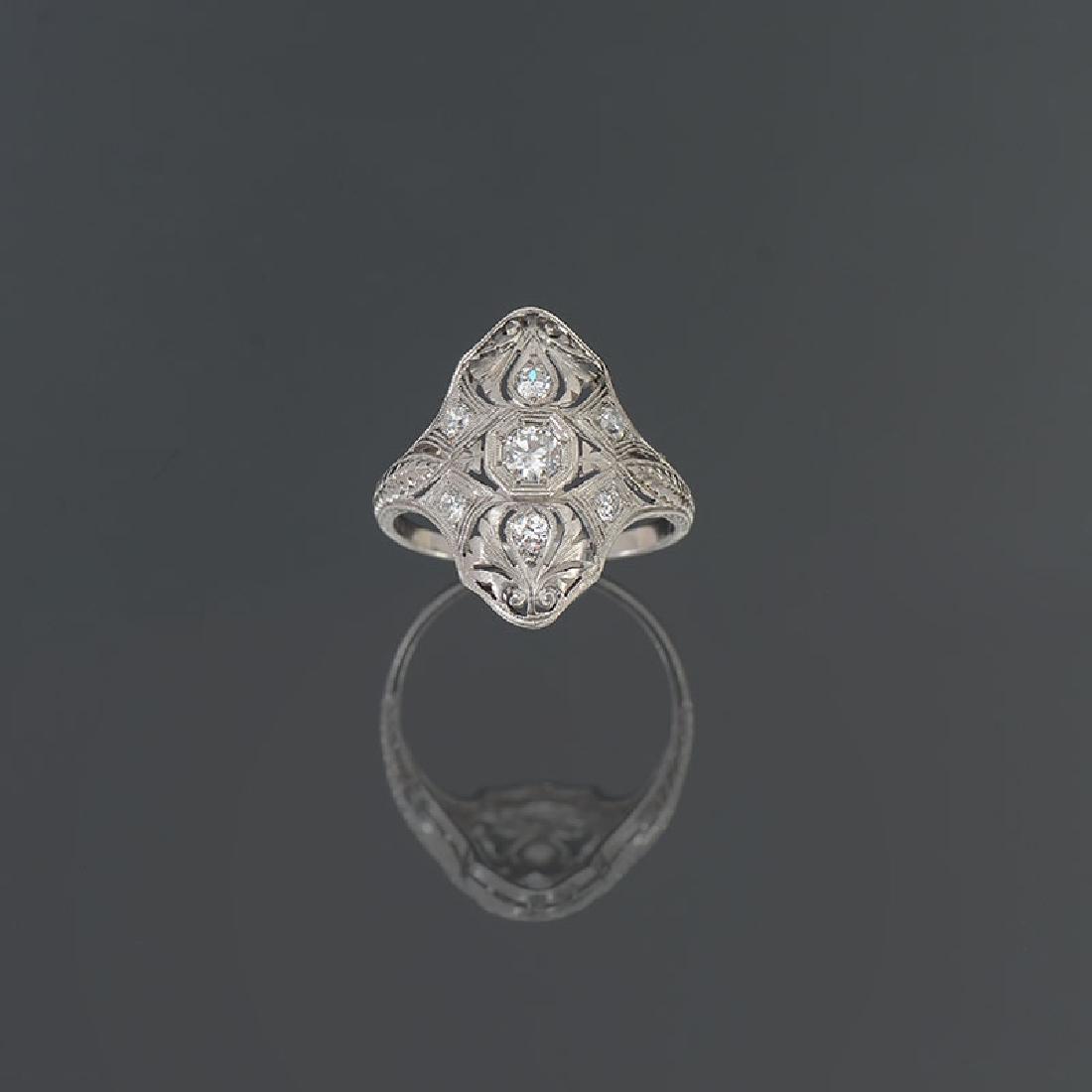 PLATINUM EDWARDIAN DIAMOND DINNER RING: PLATINUM EDWARDIAN DIAMOND DINNER RING: Finely crafted and very comfortable diamond 'dinner' ring, perfect for any meal or simply cocktails. A vertical row of three brilliant cut diamonds glisten atop