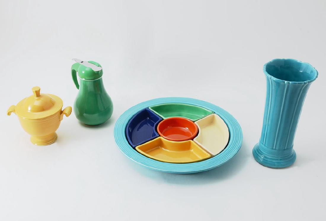 4 PIECES VINTAGE FIESTA WARE: 4 PIECES VINTAGE FIESTA WARE: 4 pieces total of vintage Fiesta ware to include 1) Relish tray with all 6 colors, turquoise tray, 11" dia. 2) Green syrup pitcher, 5 3/4" h. x 4 1/4". 3) Blue fluted vas