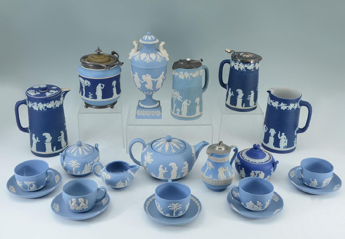 21 PIECE ESTATE WEDGWOOD JASPERWARE COLLECTION: 21 PIECE ESTATE WEDGWOOD JASPERWARE COLLECTION: An assembled collection of approx. 21 pieces of traditional blue and royal blue Wedgwood. Includes an urn, several pitchers, teapot, teacups, saucers, c