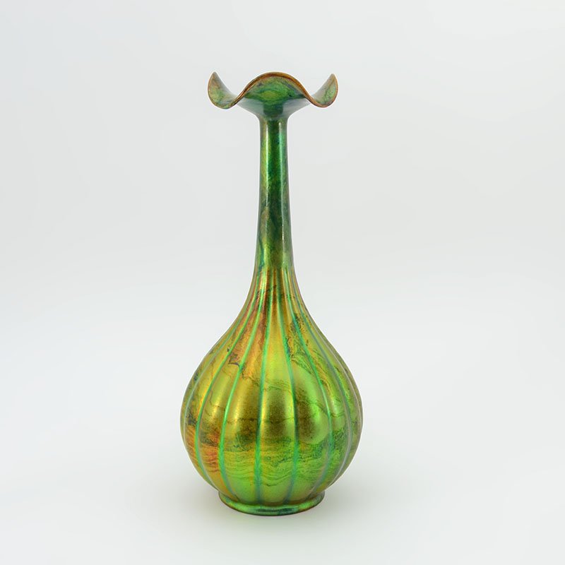 CIRCA 1902-1906 ZSOLNAY EOSIN FLUTED VASE: CIRCA 1902-1906 ZSOLNAY EOSIN FLUTED VASE: Iridescent green and yellow eosin glaze, ruffled rim over thin tapered neck, fluted bulbous body, raised Zsolnay Pecs raised churches wafer, impressed 5241 o