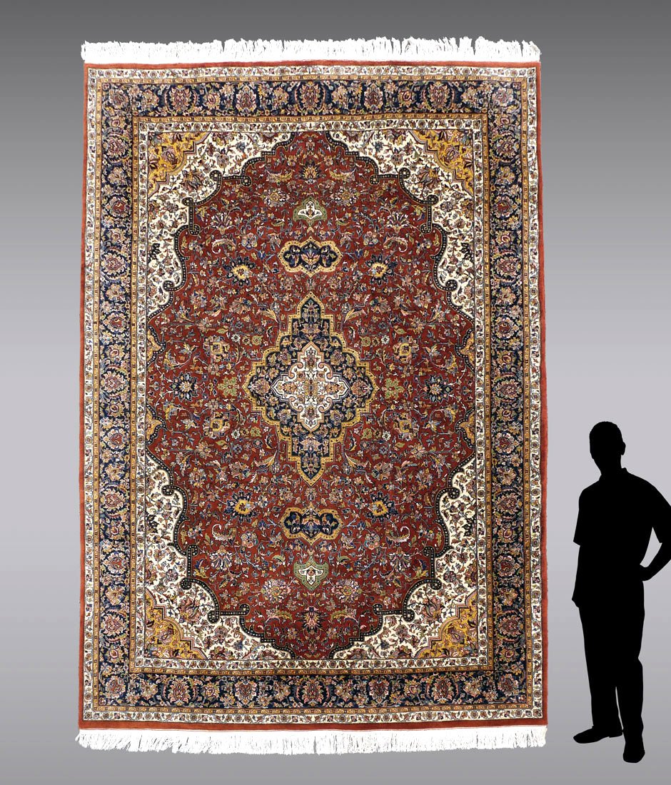 INDO-PERSIAN HK WOOL RUG, 8'10" X 12'7": APPROX 20-35 YR OLD INDO-PERSIAN HAND KNOTTED WOOL RUG, 8'10" X 12'7": This pretty rug has a diamond shaped central medallion done in white, yellow, and black on a red/rust field. There is a lot of ye