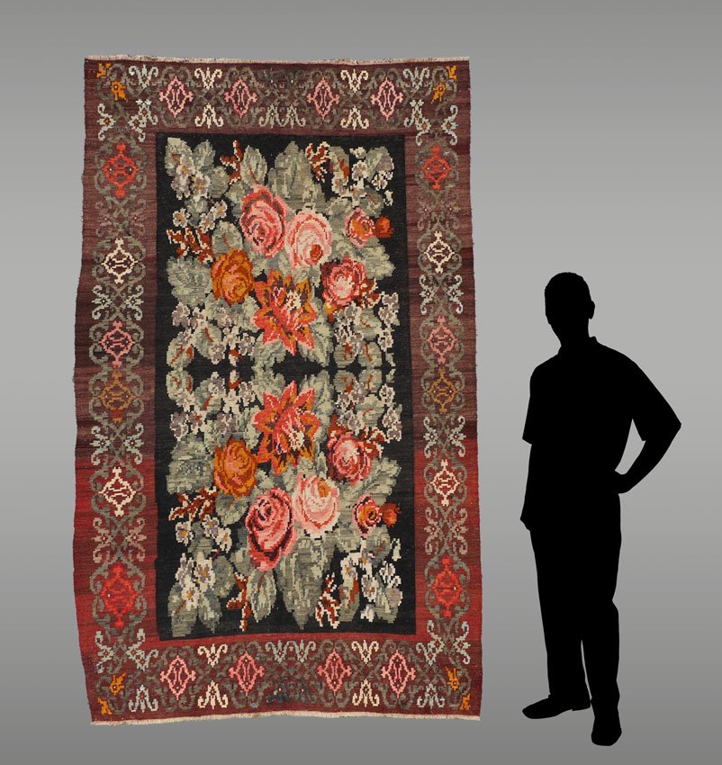 APPROX 30-50 YR OLD ROMANIAN WOVEN WOOL FLATWEAVE RUG: APPROX 30-50 YR OLD ROMANIAN WOVEN WOOL FLATWEAVE RUG, 5'4" X 8'7": This flatweave has a design of European roses on a bed of pale green leaves that repeats from one half of the rug to the other.