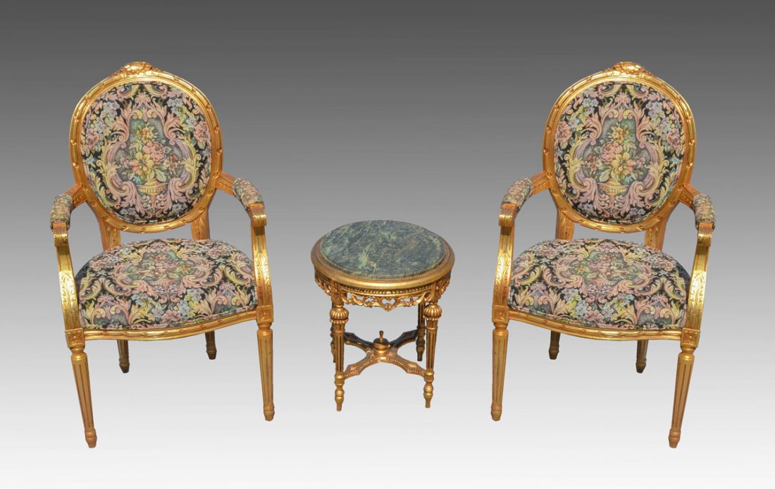 3 PIECE ITALIAN GILT DECORATED PARLOR SET: 3 PIECE ITALIAN GILT DECORATED PARLOR SET: 3 pieces total to include 2 parlor arm chairs, carved frames, medallion backs, vibrant floral rococo style upholstery. Measure41" h. x 24" x 25 1/2". Sold wi