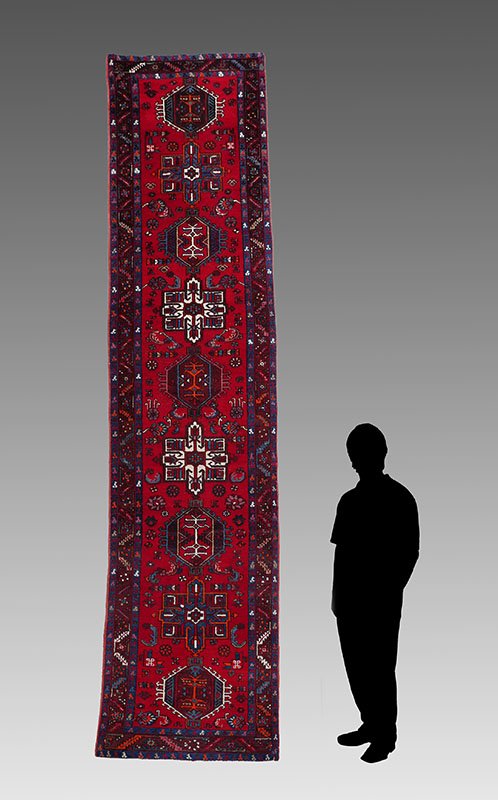 PERSIAN HK WOOL RUNNER, 3'3" X 14'3": APPROX 20-35 YR OLD PERSIAN HAND KNOTTED WOOL RUNNER, 3'3" X 14'3": This rug has a design like a Karaja but the colors and weave are different. The bright red field has alternating geometric shaped me