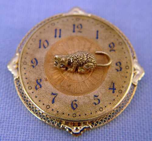 CLOCK FACE PIN PENDANT WITH SPINNING CAT 14k: CLOCK FACE PIN PENDANT WITH SPINNING CAT: Fanciful piece of 14k yellow gold in a clock face motif centered by a spinning cat, note the detailed fur and marcasite eyes, black enameled numbers to clock
