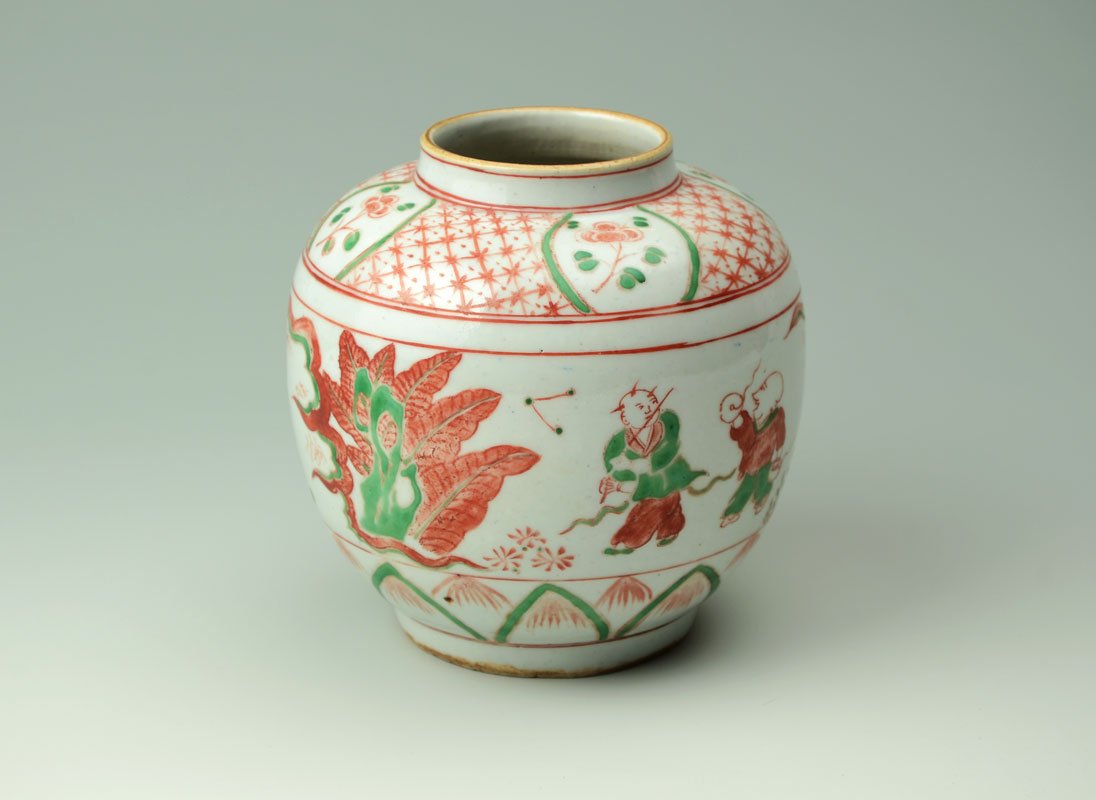 CHINESE POLYCHROME GINGER JAR: CHINESE POLYCHROME GINGER JAR: Exterior with red and green geometric, floral and outdoor genre scenes, footed base, no visible marks. 6 1/4'' h. x 6 1/4'', no lid.