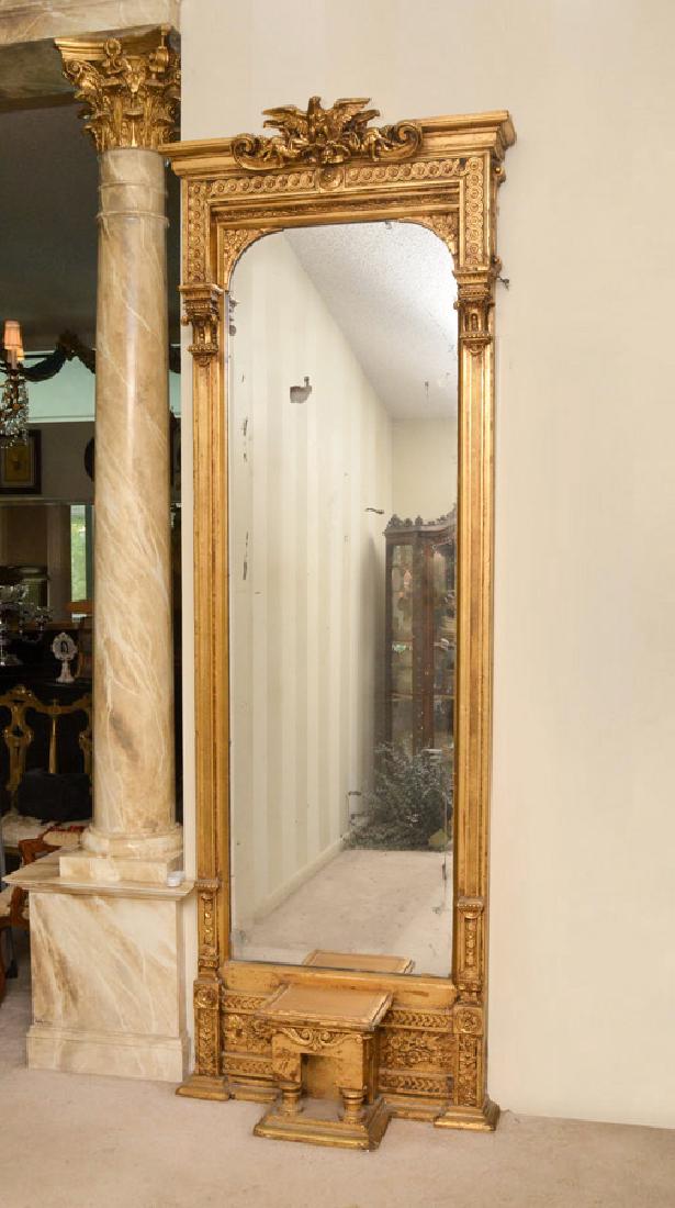 19TH CENTURY RENAISSANCE REVIVAL GILT PIER MIRROR: 19TH CENTURY RENAISSANCE REVIVAL GILT PIER MIRROR: Giltwood frame with carved and applied accents. Center crest with spread wing eagle, seated musicians and foliate scroll, stepped pediment over carve
