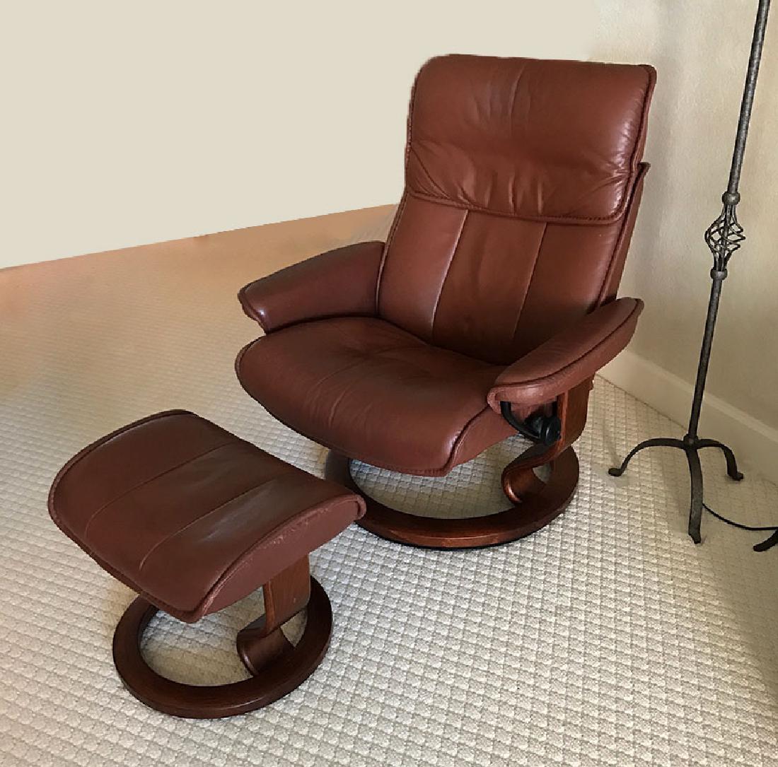 EKORNES STRESSLESS LEATHER CHAIR & OTTOMAN: EKORNES STRESSLESS RECLINING LEATHER CHAIR & OTTOMAN: Brown leather recliner with matching ottoman, recliner measures 39 1/2'' h. x 34 1/4'' x 38'', ottoman 15'' x 20 1/2'' x 15 1/2''.