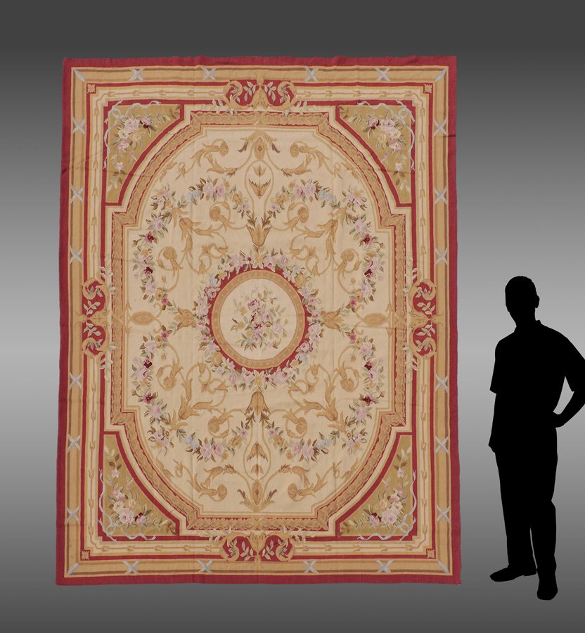 CHINESE AUBUSSON DESIGN WOOL NP RUG, 8' X 10': APPROX 20-35 YR OLD CHINESE AUBUSSON DESIGN WOOL NEEDLEPOINT RUG, 8' X 10': This lovely French Aubusson design rug has an oval shaped main field around a round "outline" medallion. The field and its c