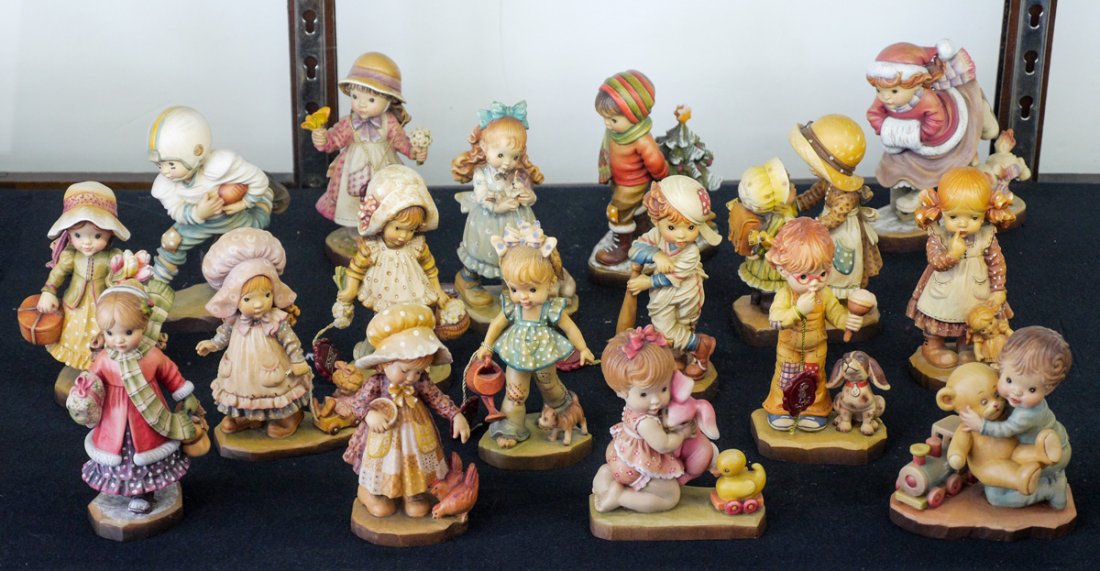 18 SARAH KAY ANRI ITALIAN CARVED WOOD FIGURINES: 18 SARAH KAY ANRI ITALIAN CARVED WOOD FIGURINES: An assembled collection of Anri carved polychrome decorated wood figures, most designed by Sarah Kay, 2 by John Sands, each approx. 6 3/4" h.