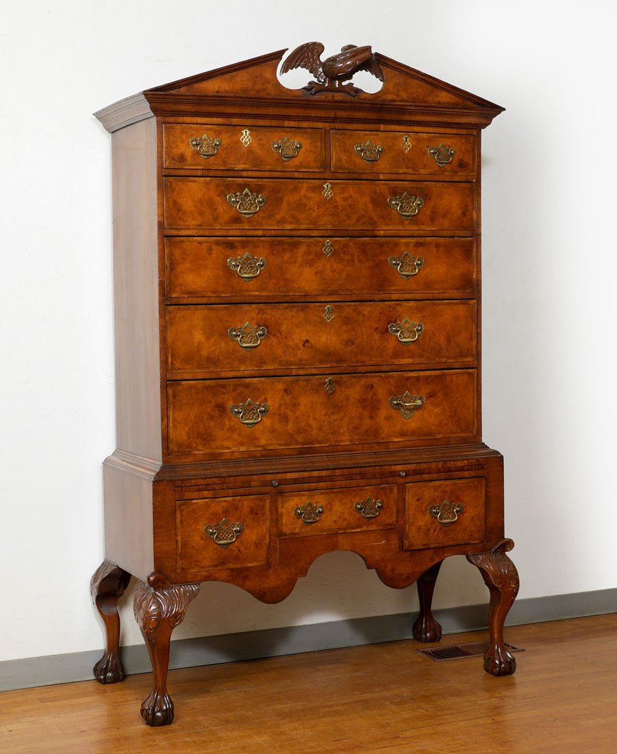 C. HINDLEY & SONS BURLWOOD HIGH CHEST ON STAND: C. HINDLEY & SONS BURLWOOD HIGH CHEST ON STAND: Architectural pediment with center carved full figural eagle finial, stepped cornice, 2 half drawers over 4 graduated full length drawers. Base with sli