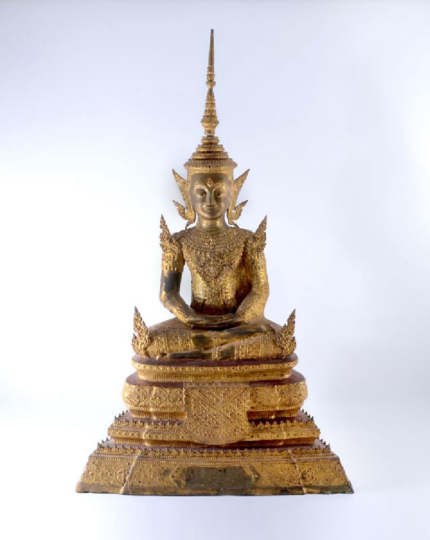 LARGE THAI GILT BRONZE SEATED BUDDHA: LARGE THAI GILT BRONZE SEATED BUDDHA: Cast gilded bronze figure of Buddha in the lotus seated position, on 4 tier base throne base, red painted accents, applied small mirrored dots, overall measures 3