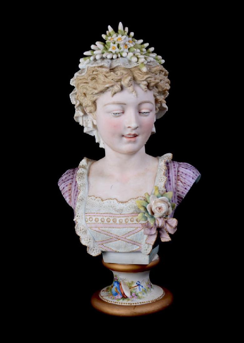 SIGNED PAUL DUBOY BISQUE BUST OF A WOMAN: SIGNED PAUL DUBOY HAND PAINTED BISQUE BUST OF A WOMAN: Hand painted bust of a beauty with lace in hair, dress with applied flower boutonniere, affixed to hand painted base with musical instruments and