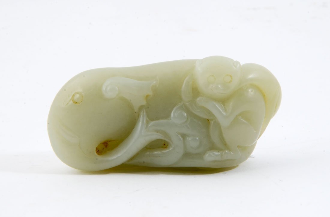 CHINESE CARVED JADE MONKEY ELEPHANT FIGURAL GROUP: CHINESE CARVED JADE MONKEY ON ELEPHANT FIGURAL GROUP: Carved green celadon jade or similar stone figural group with a monkey riding on the back of an elephant, 1 5/8'' h. x 3 1/4''.