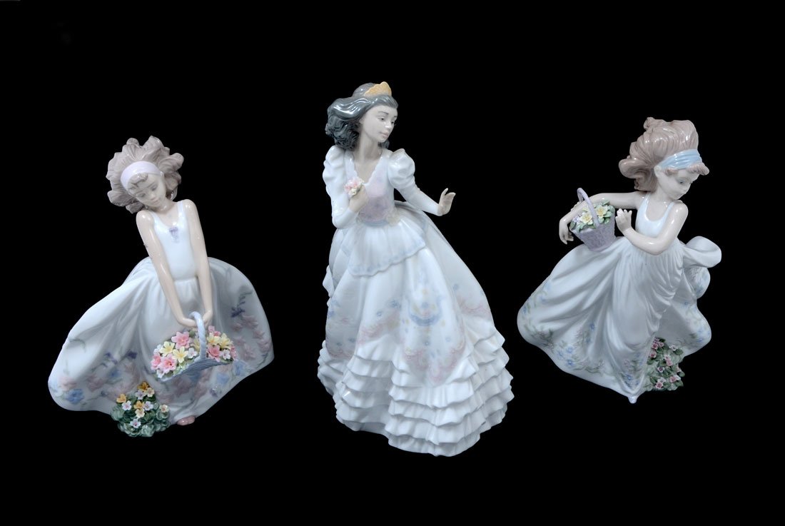3 WOMEN LLADRO PORCELAIN FIGURINES: 3 WOMEN LLADRO PORCELAIN FIGURINES: 3 pieces total to include 1) Quinceanera, issued 2000, retired 2004, 12 1/2'' h. 2) Wildflowers, issued 1999, 10 1/4'' h. 3) Floral Path, issued 1999, retired 2007,