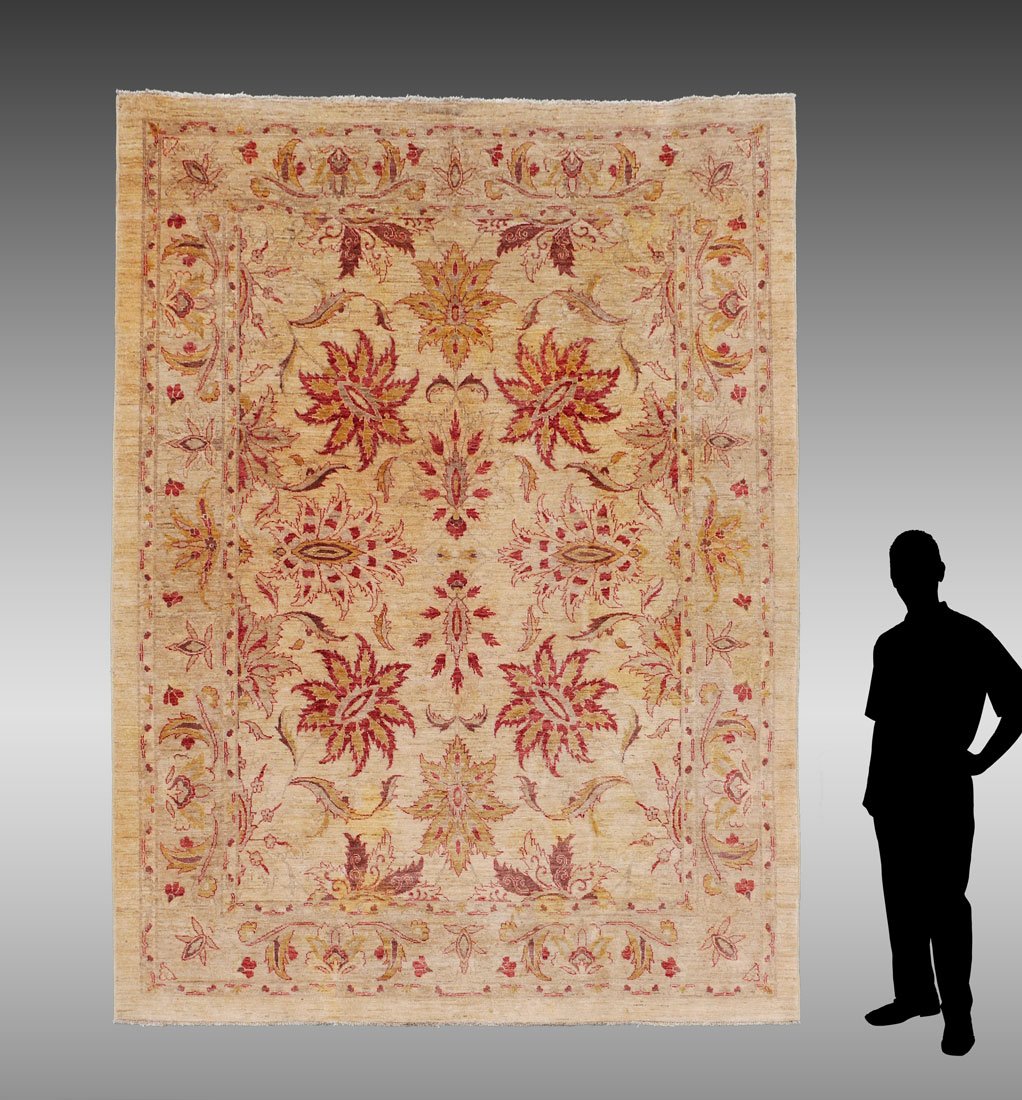 INDO-TURKISH OUSHAK HK WOOL RUG, 8'1" X 10'3": APPROX 25-50 YR OLD INDO-TURKISH OUSHAK DESIGN HAND KNOTTED WOOL RUG, 8'1" X 10'3": This rug has the look of an Antique Oushak with its ivory field mostly soft colored larger sized floral motifs. Thre