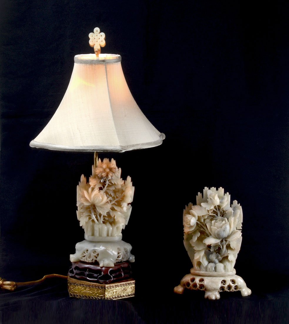CARVED SOAPSTONE LAMP AND FLORAL GROUP: CARVED SOAPSTONE LAMP AND FLORAL GROUP: 2 piece total to include 1) Carved soapstone floral group body with center light over carved wood stand over embossed metal base, single top socket fixture, 24"