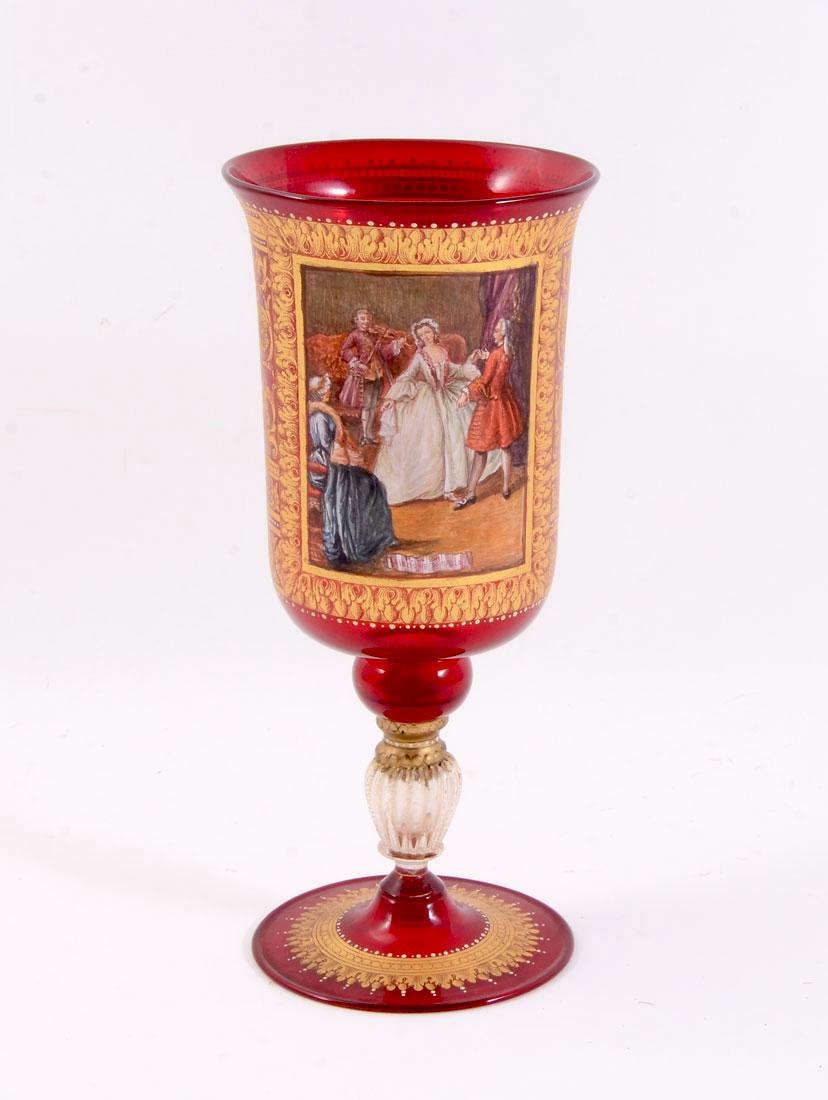 ITALIAN HAND PAINTED RUBY GLASS CHALICE: ITALIAN HAND PAINTED RUBY GLASS CHALICE: Ruby glass chalice or footed vase with hand painted interior genre scene of dancers titled ''La Lezione di Ballo'' and name P. Longhi. Rococo style gilt foliat