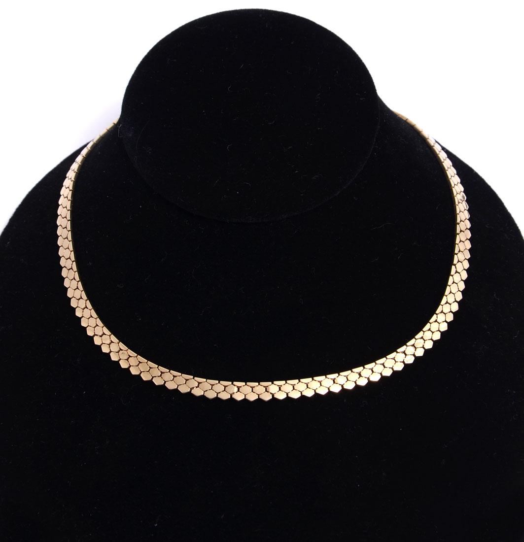 29.3 GRAM ITALIAN 14K TEXTURED CHOKER: 29.3 GRAM ITALIAN 14K TEXTURED CHOKER: Ca 1980 honeycomb textured choler is 16'' long and 5.5mm wide with a safety clasp. Total weight is 29.3 grams. Sold with current Atlanta Gemological GIA graduate