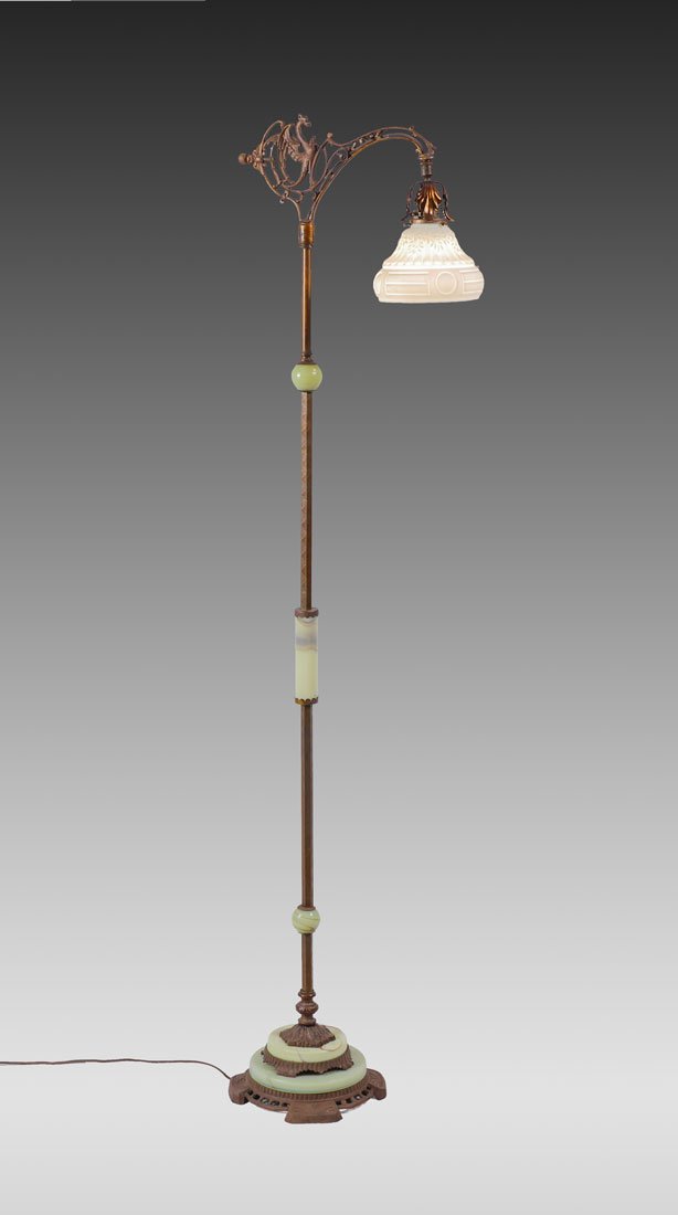 CAST IRON AND ONYX GRIFFIN FLOOR LAMP: CAST IRON AND ONYX GRIFFIN FLOOR LAMP: Patinated cast iron bridge with figural griffin and scrolls, metal shaft with shaped onyx accents, green onyx inserts in base, 64'' 1/2'' h. x 15'' top width. Em