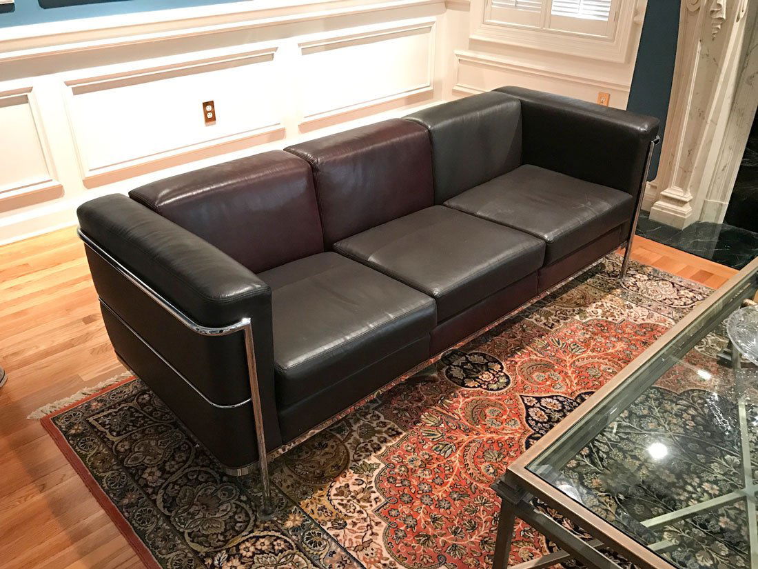 JACK CARTWRIGHT LE CORBUSIER STYLE LEATHER SOFA: JACK CARTWRIGHT LE CORBUSIER STYLE LEATHER SOFA: Chrome steel tube frame, brown leather upholstery, Jack Cartwright tag under seat. Approx. 27" h. x 80" x 31".