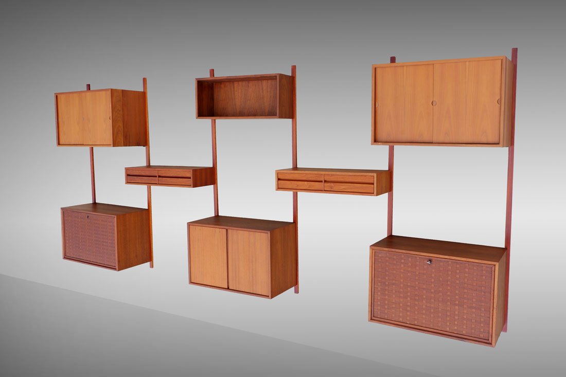 POUL CADOVIOUS CADO 5 BAY WALL UNIT: POUL CADOVIOUS CADO 5 BAY WALL UNIT: Six 72 1/4" long teak support rods with 9 assorted cabinets and storage units to include one open storage 13 1" h. x 31 1/2" x 9 1/2",two basket weave design drop 