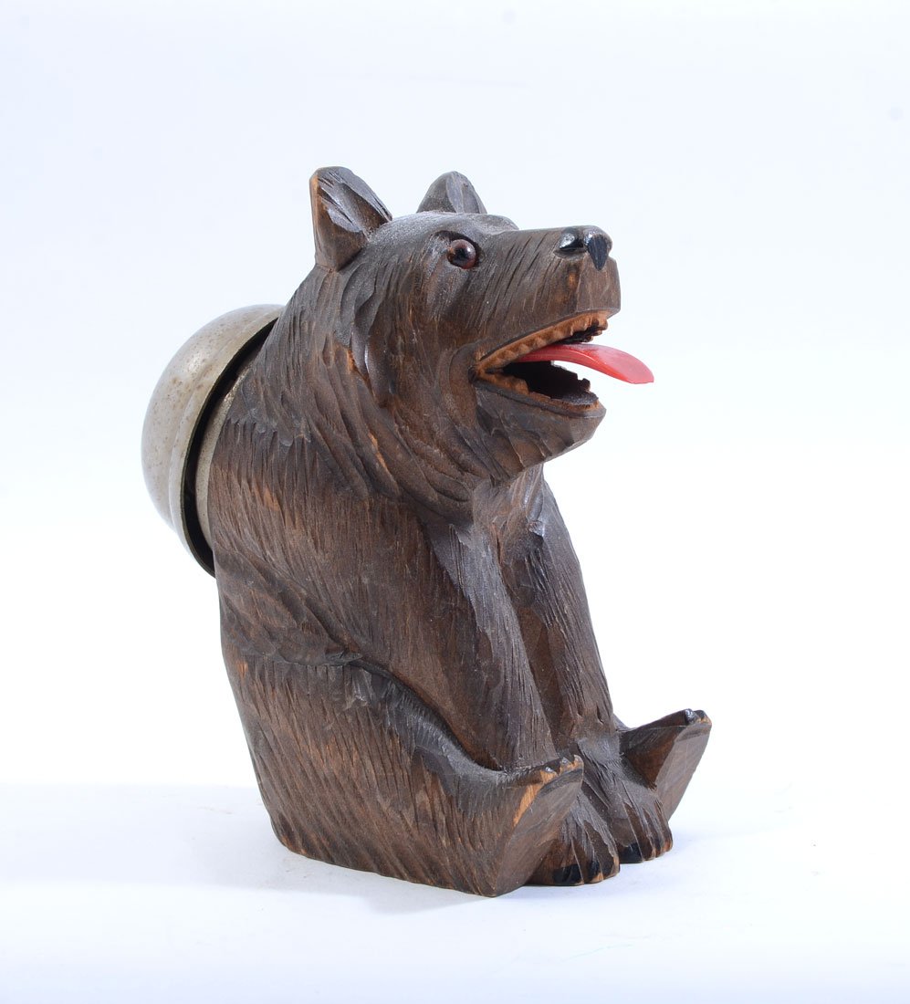 BLACK FOREST CARVED FIGURAL BEAR SERVICE BELL: BLACK FOREST CARVED FIGURAL BEAR SERVICE BELL: Figure of a seated bear with service bell attached to it's back, when tongue is pressed down it activates the bell. Overall measures 5" h. x 2 1/2" x 4 1