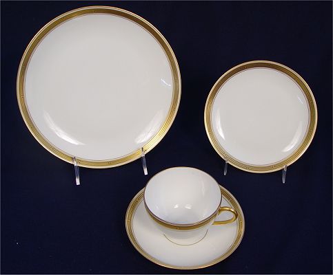 PICKARD FINE CHINA LUNCHEON SET: PICKARD FINE CHINA LUNCHEON SET: Hand painted gold and black design. 25 piece service to include 6 luncheon plates (8 5/8"), 6 salad plates (7 5/8"), 6 bread plates, 4 cups, 4 saucers, cream pitcher,