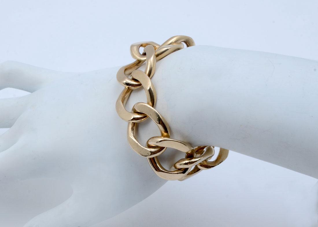 14K 97.1 GRAM SOLID CUBAN LINK BRACELET: 14K 97.1 GRAM SOLID CUBAN LINK BRACELET: 14K yellow gold solid Cuban link bracelet. Width: 7/8'' '' Length: 6.5'' Weight: 97.1 grams. Description provided by Graduate GIA Gemologist.