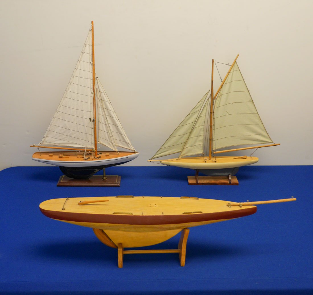 3 PAINTED WOOD MODEL SAIL POND BOATS: 3 PAINTED WOOD MODEL SAIL POND BOATS: 20th century, an assembled collection of 3 to include 1) Painted blue and white hull, single mast, 3 sails, 18 1/4" h. x 21" x 3", stand 2 3/4". 2) Painted blue a