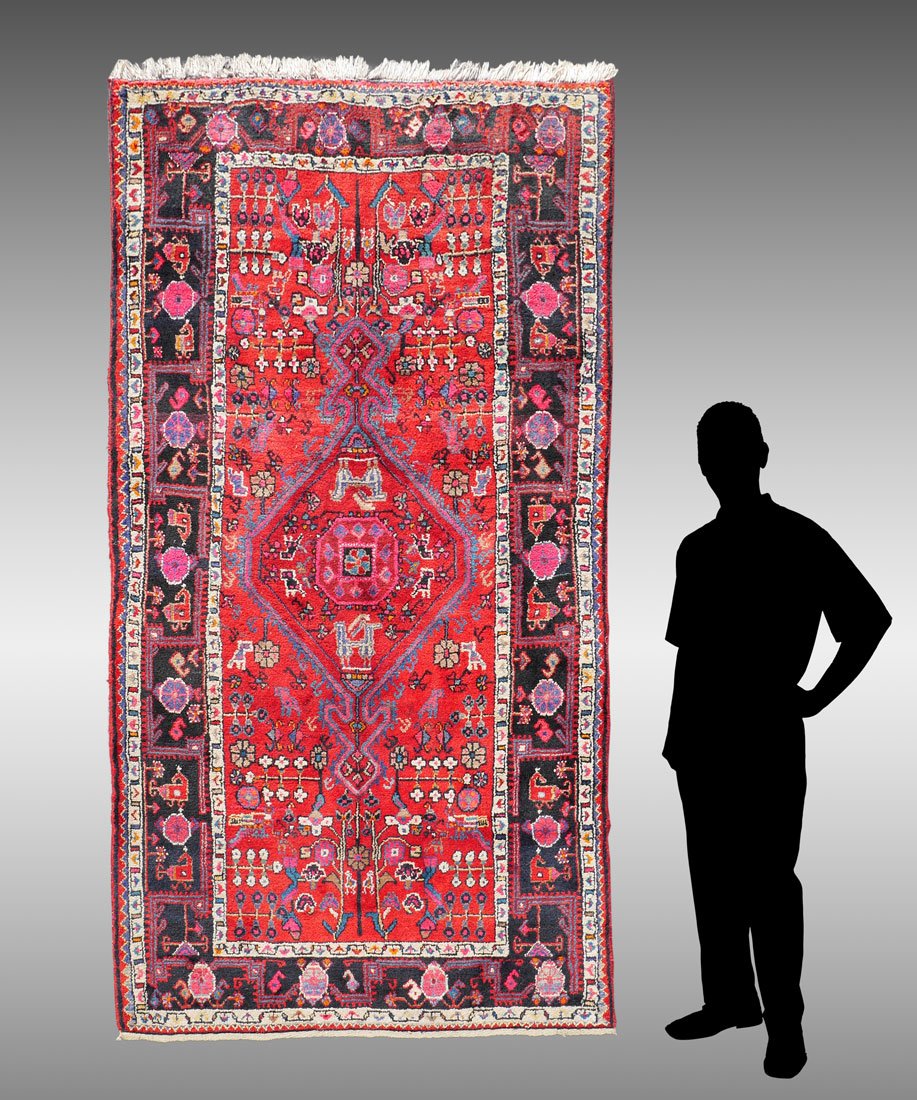 PERSIAN HK WOOL RUG, 4'7" x 8': APPROX 15-30 YR OLD PERSIAN HAND KNOTTED WOOL RUG, 4'7" x 8': This more modern village rug has a wild combination of colors that somehow works to make a vibrant rug. This definitely took the weaver ou