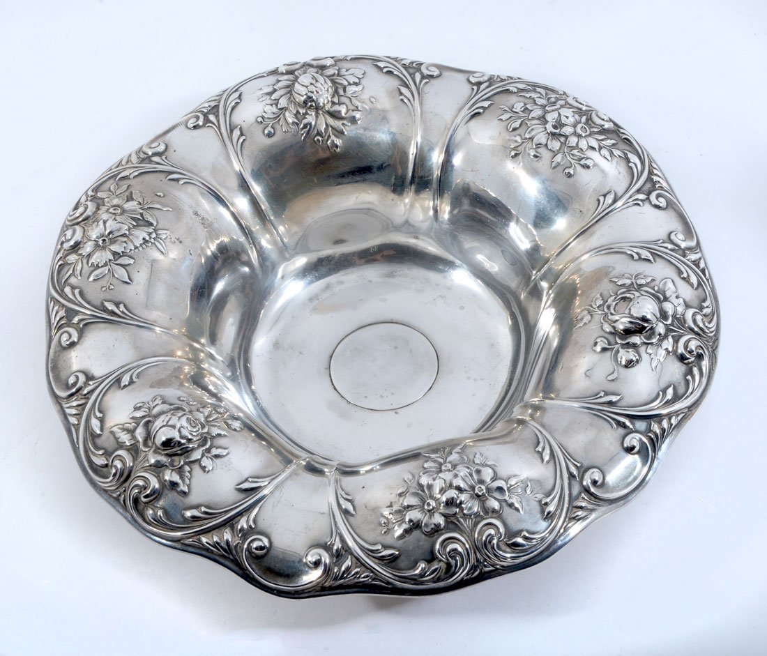 GORHAM EMBOSSED FLORAL MOTIF BOWL: GORHAM EMBOSSED FLORAL MOTIF BOWL: Center bowl with embossed floral motif shaped rim, well marked with Gorham hallmarks, Sterling, A1338, Theodore B. Starr, New York. Overall 2 1/2" x 10" dia., approx