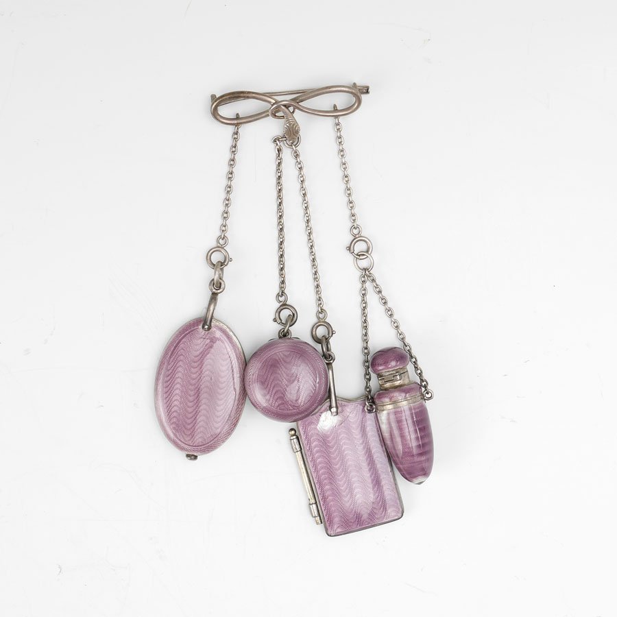 4-PIECE GUILLOCHE CHATELAINE: 4-PIECE GUILLOCHE CHATELAINE: 4-piece chatalaine with purple guilloche enamel exterior, no visible markings as to maker or metal, to include a mirror, pill box, vinaigrette, and writing pad, attached 