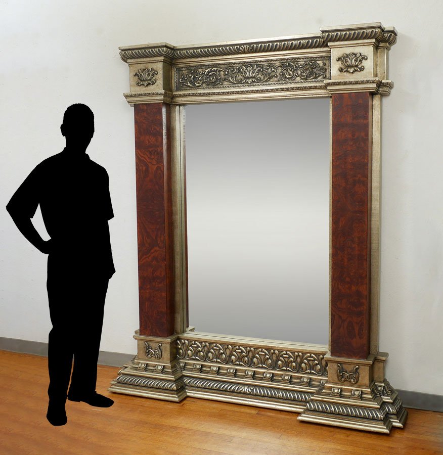 LARGE DECORATIVE FLOOR PIER MIRROR: LARGE DECORATIVE FLOOR PIER MIRROR: Composite frame with foliate scroll and gadroon designs, faux burl wood stiles, overall measures 84'' h. x 65 1/2'' x 12''.