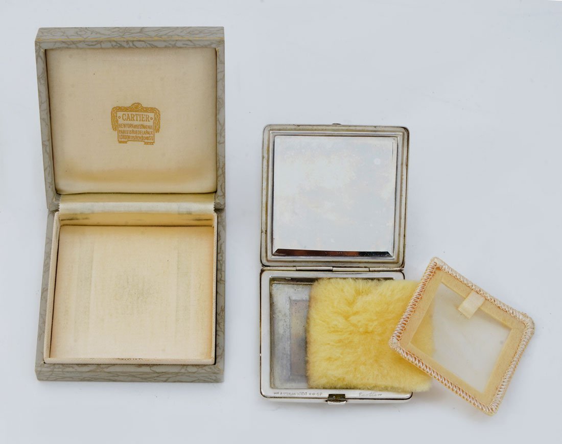 CARTIER STERLING AND 14K GOLD COMPACT: CARTIER STERLING AND 14K GOLD COMPACT: Watson for Cartier sterling and 14k gold square compact with puff, 2 1/2'' h. x 2 1/2''. Sold with fitted Cartier box.