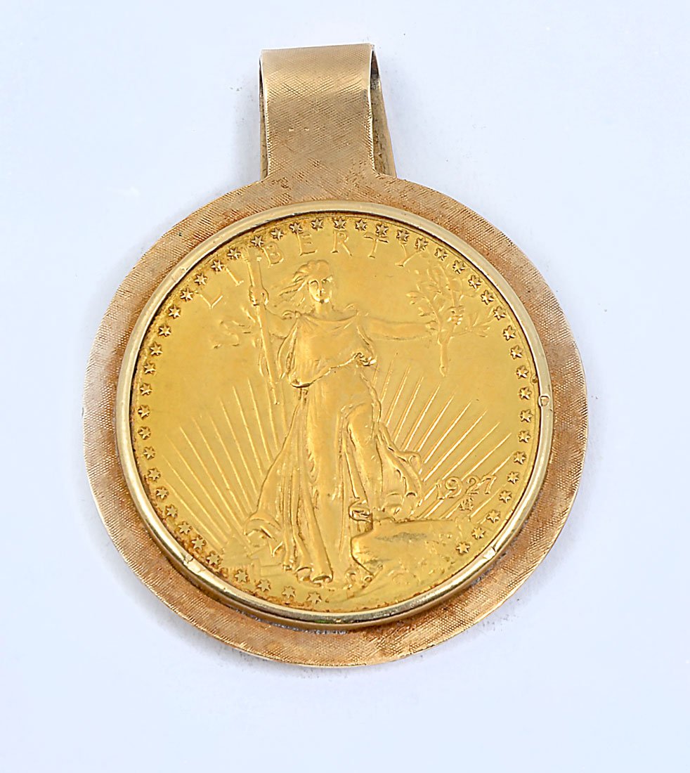 1927 $2O GOLD DOUBLE EAGLE COIN MONEY CLIP: 1927 $2O GOLD DOUBLE EAGLE COIN MONEY CLIP: 1927 gold St. Gaudens double eagle, set into 14k yellow gold money clip frame. Approx. 45.2 grams clip and coin combined.