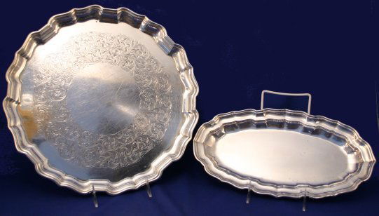 2 BIRKS STERLING TRAYS: 2 CANANDIAN BIRKS STERLING TRAYS: 1) Round tray, 13 3/4" dia. aoorox. 1045 grams or 33.60 oz. 2) Smaller oval tray, 12 3/4"l, approx. 340 grams or 10.93 oz.