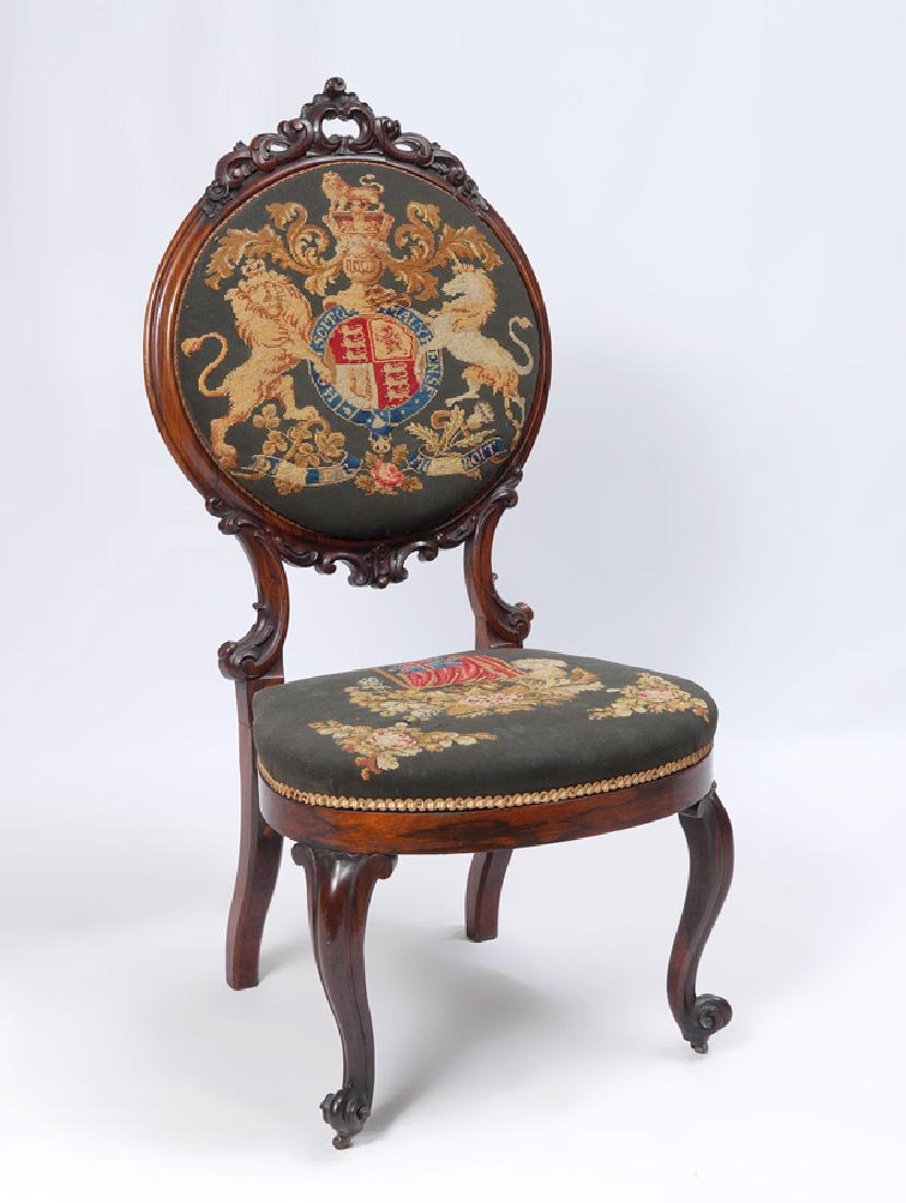 ENGLISH VICTORIAN NEEDLEPOINT SIDE CHAIR: ENGLISH VICTORIAN NEEDLEPOINT SIDE CHAIR: Decidedly British with round back with carved crest and supports. Shaped skirt and legs with carved front legs ending in castors. Needlepoint upholstered with