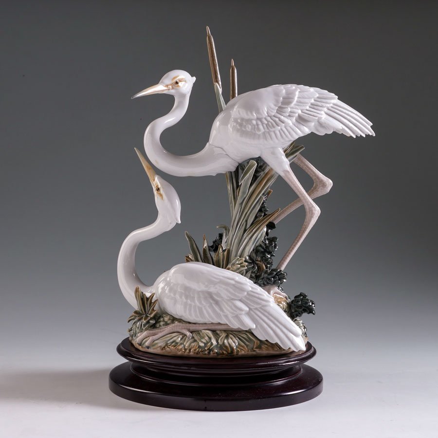 LLADRO MARSHLAND MATES 5691 PORCELAIN FIGURINE: LLADRO MARSHLAND MATES 5691 PORCELAIN FIGURINE: Spanish name "Pareja de Garzas Recogidas", sculptor Salvador Debon, issued 1990, retired 2004, glazed finish, 13 3/4" h., sold with wood stand.