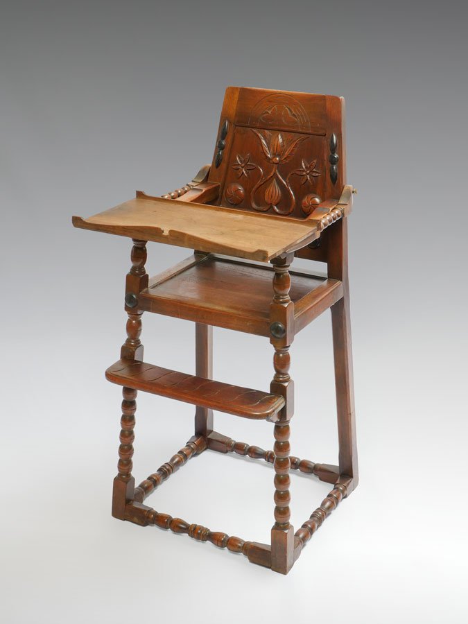 KITTINGER CARVED WILLIAM & MARY HIGH CHAIR: KITTINGER CARVED WILLIAM & MARY HIGH CHAIR: Youth high chair with carved back, turned supports and stretchers, Kittinger tag under seat. 40 1/2" h. x 26" x 31 1/2".