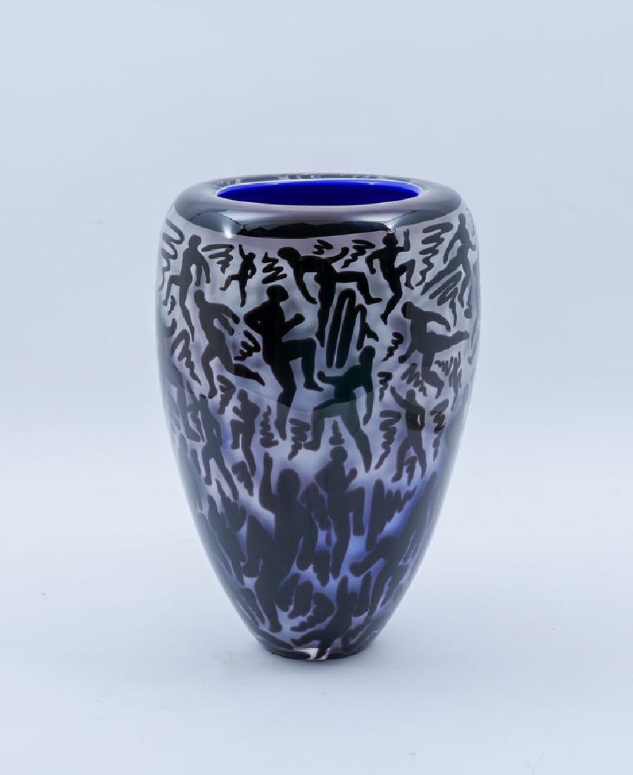 DUNCAN MCCLELLAN RUNNING MAN ART GLASS VASE: DUNCAN MCCLELLAN RUNNING MAN ART GLASS VASE: Tapered form, white graduating to purple ground, figural running man and doodles designs, cobalt interior. Signature on base partially obscured by applied